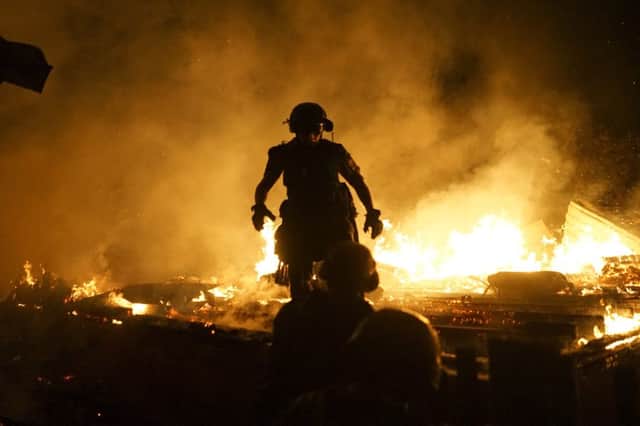 Firefighters tackle a blaze in Donetsk as artillery duels brought the conflict in Ukraine back to life despite a ceasefire agreement. Picture: AP