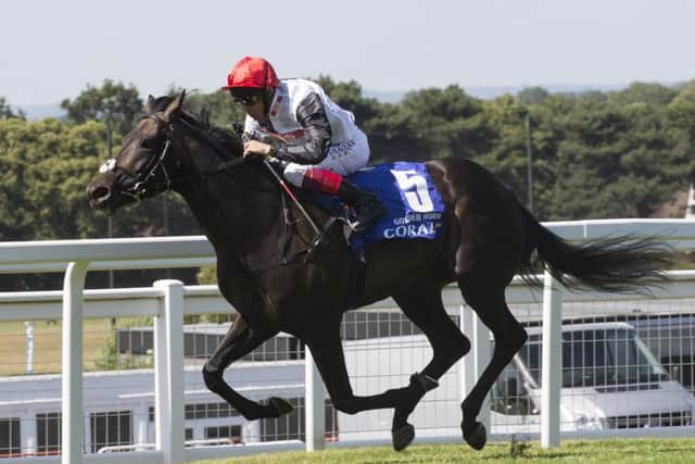 Golden Horn, ridden by Frankie Dettori, leads the field to win the Coral-Eclipse Stakes. Picture: PA
