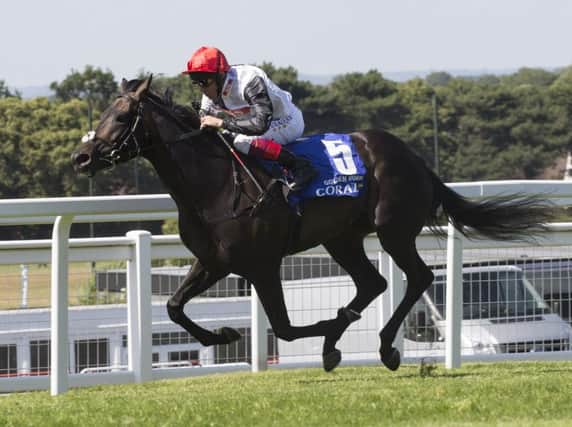 Golden Horn, ridden by Frankie Dettori, leads the field to win the Coral-Eclipse Stakes. Picture: PA