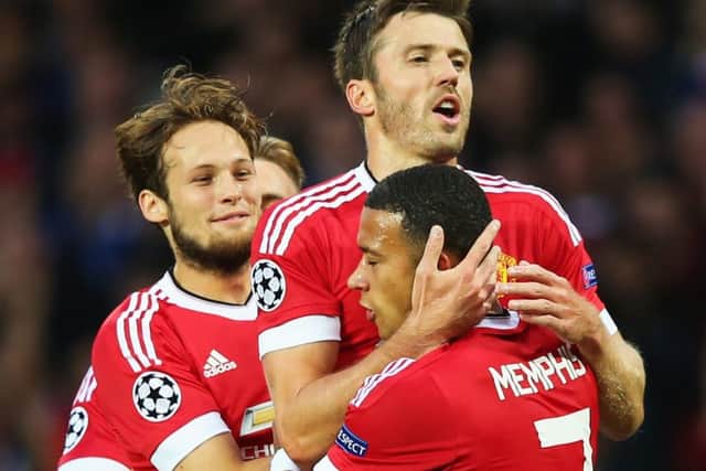Manchester United's Memphis Depay celebrates with Michael Carrick and Daley Blind after scoring the first of his two goals. Picture: Getty