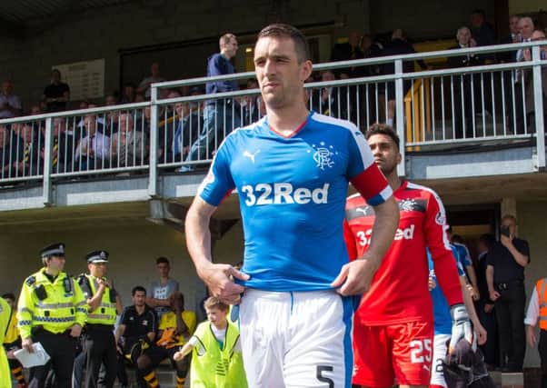 Wallace leading Rangers out at Alloa on Sunday - the same ground where the Ibrox side crashed out of the Petrofac Cup last season. Picture: SNS