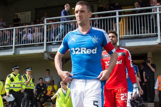Wallace leading Rangers out at Alloa on Sunday - the same ground where the Ibrox side crashed out of the Petrofac Cup last season. Picture: SNS