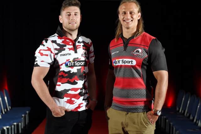 Jack Cuthbert, left and Anton Bresler model the new kits. Picture: SNS
