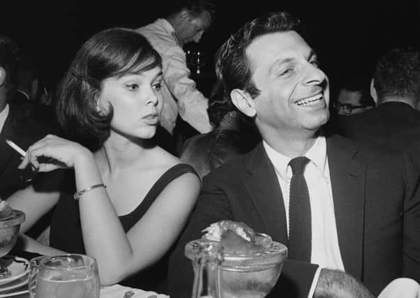 Yvonne Craig, left, in 1962, with actor Mort Sahl in Los Angeles. Picture: Getty