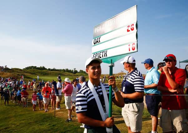 Ensuring the crowds know the score during the final round of the US PGA. Picture: Getty