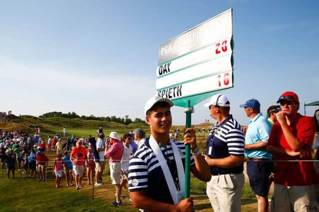 Ensuring the crowds know the score during the final round of the US PGA. Picture: Getty