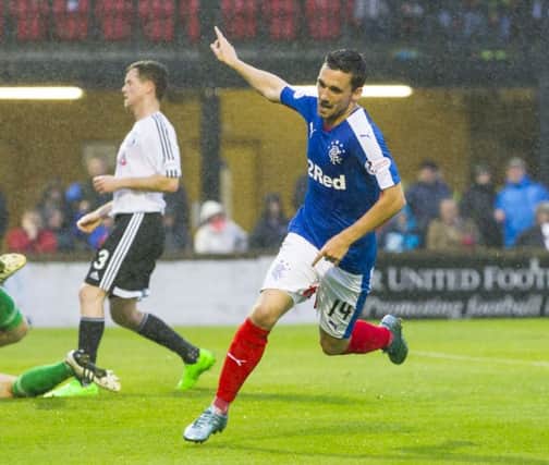 Nicky Clark celebrates after opening the scoring for Rangers against Ayr United last night. Picture: SNS