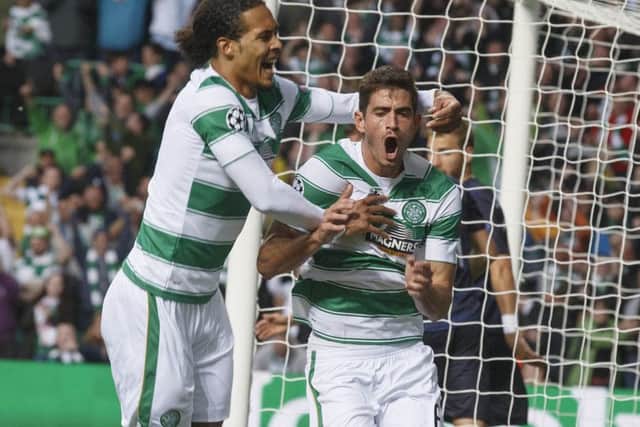 Nir Bitton of Celtic celebrates with team-mate Virgil van Dijk after scoring his team's second goal. Picture: Getty