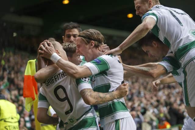 Leigh Griffiths celebrates with team-mates after scoring his team's first goal. Picture: Getty