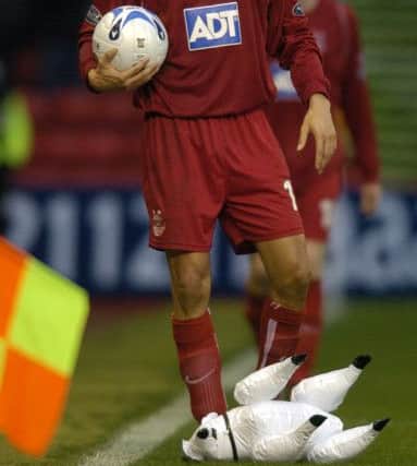 Just baaanter: Richie Byrne has an inflatable sheep thrown at him during a 2005 clash between Aberdeen and Celtic. Picture: Neil Hanna