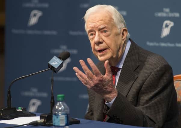 An upbeat Jimmy Carter announces that the cancer he thought had been removed earlier this month has now spread to his brain. Picture: AP
