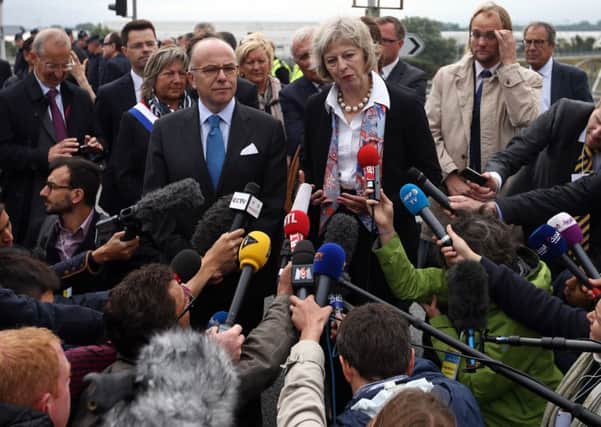 French interior minister Bernard Cazeneuve with Home Secretary Theresa May at the Port of Calais. Picture: PA