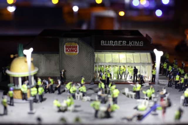 Detail from an artwork by Jimmy Cauty titled The Aftermath Displacement Principle - a model of an entire town frozen just after a huge period of civil unrest. Picture: PA