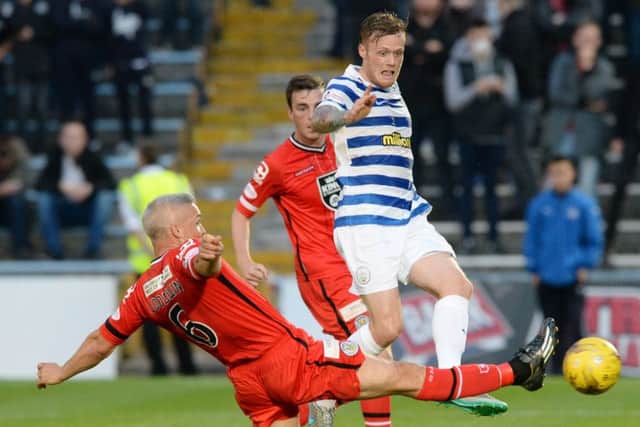 St Mirrens Jim Goodwin, left, slides in to tackle Denny Johnstone. Picture: SNS