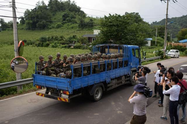 South Korean soldiers head for the border village of Panmunjom, where talks were held in a bid to reduce tension between the two sides. Picture: Getty