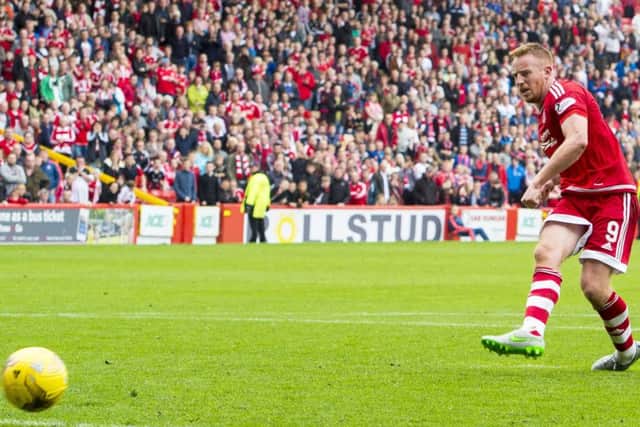 Aberdeen's Adam Rooney rounds off the scoring from the penalty spot. Picture: SNS
