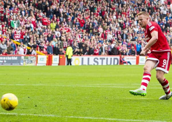 Aberdeen's Adam Rooney rounds off the scoring from the penalty spot. Picture: SNS