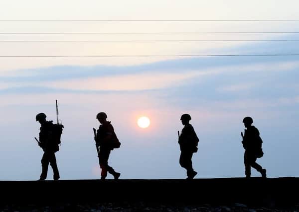 South Korean marines patrol on Yeonpyeong island, South Korea, yesterday. Picture: AP