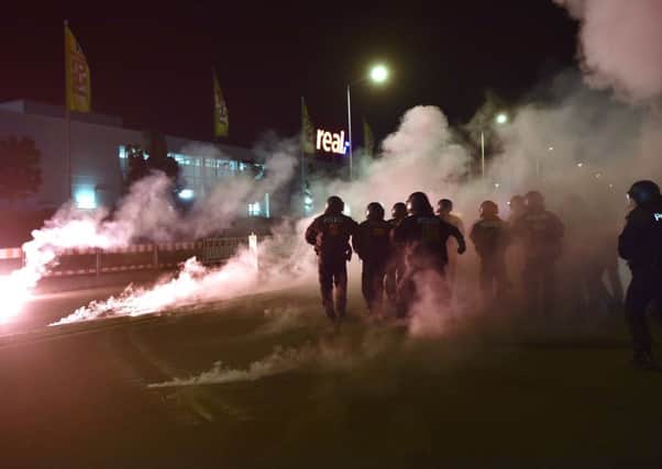 Right-wing demonstrators clash with police as they protest against the refugee camp over the weekend. Picture: Getty