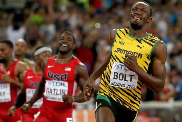 A smiling Usain Bolt realises he has beaten Justin Gatlin to the 100m title in Beijing. Picture: Patrick Smith/Getty