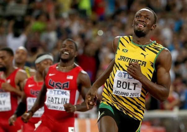 A smiling Usain Bolt realises he has beaten Justin Gatlin to the 100m title in Beijing. Picture: Patrick Smith/Getty