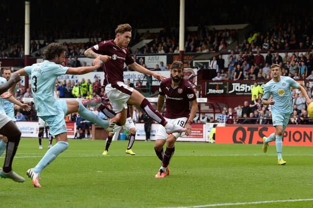 Sam Nicholson is first to react after Juanmas penalty was parried by Partick goalkeeper Tomas Cerny. Picture: SNS