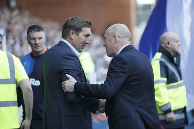 Managers Alan Stubbs and Mark Warburton shake hands after the game. Picture: Robert Perry