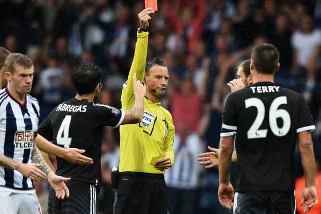 Referee Mark Clattenburg shows Chelsea skipper John Terry the red card. Picture: Getty