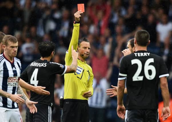 Referee Mark Clattenburg shows Chelsea skipper John Terry the red card. Picture: Getty