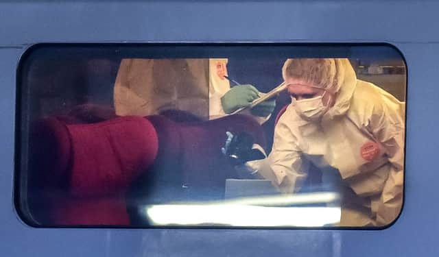 Police officers investigate the crime scene inside the train in Arras, northern France. Picture: AFP/Getty
