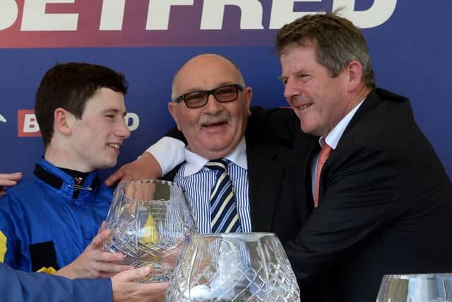 Jockey Oisin Murphy, left, owner Tony Byrne and trainer Joe Tuite celebrate after Litigant won the Betfred Ebor. Picture: PA
