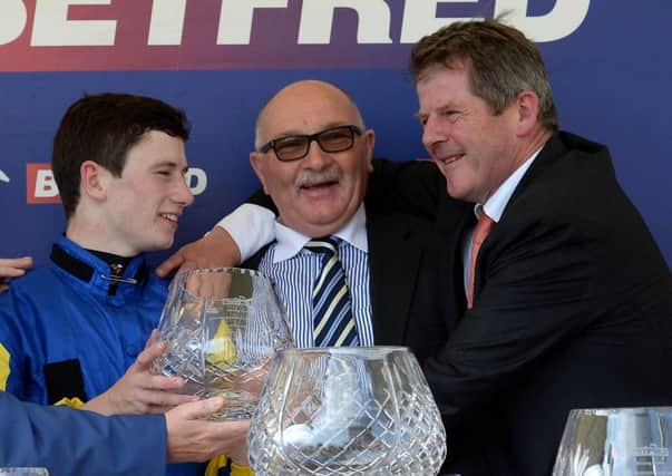 Jockey Oisin Murphy, left, owner Tony Byrne and trainer Joe Tuite celebrate after Litigant won the Betfred Ebor. Picture: PA
