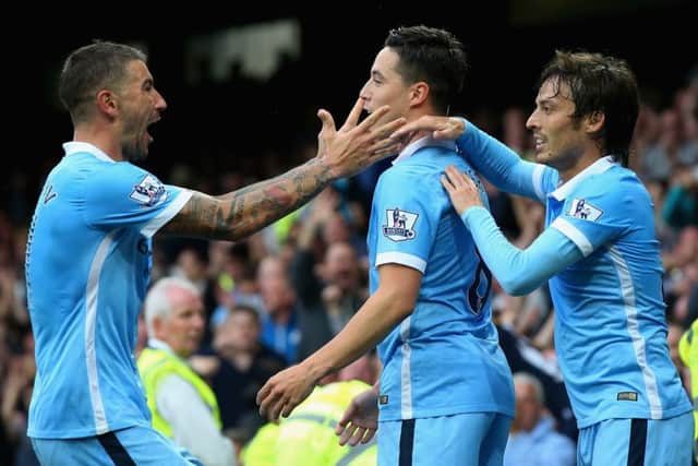 Samir Nasri, centre, celebrates scoring Manchester Citys second goal against Everton. Picture: Getty