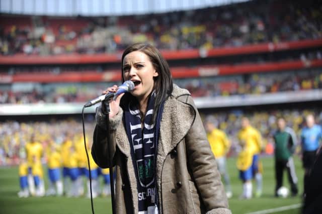 Amy Macdonald sings Flower of Scotland before Scotland's match against Brazil in London. Picture: Phil Wilkinson