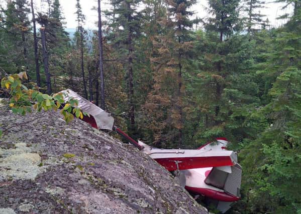The wreckage of a eaplane which crashed during a sightseeing trip in the Les Bergeronnes area of Quebec province, Canada. Picture: PA