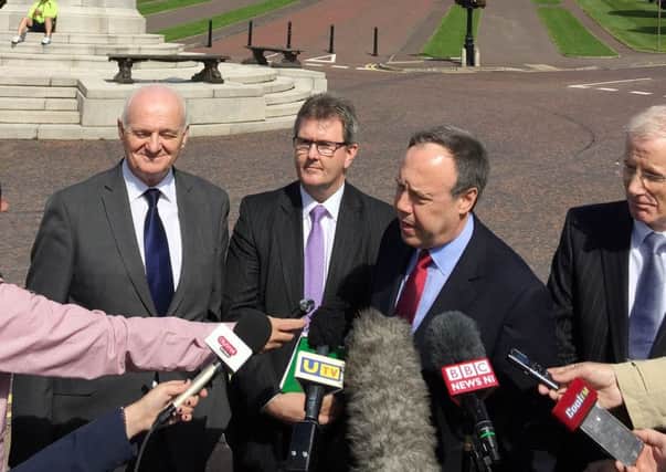 DUP deputy leader Nigel Dodds flanked by William McCrea (left), and MPs Jeffrey Donaldson (second left) and Gregory Campbell (right) outside Stormont yesterday. Picture: PA