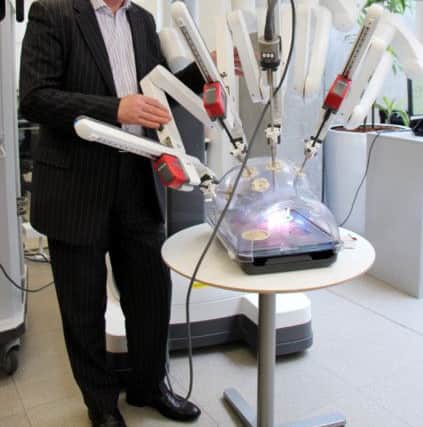 Urological surgeon Sam McClinton with the Robotic-Assisted Surgical System. Picture: Hemedia