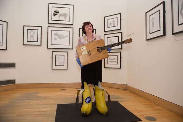 Councillor Sadie Docherty, Lord Provost of Glasgow, tries out some of the Connolly memorabilia. Picture: John Devlin