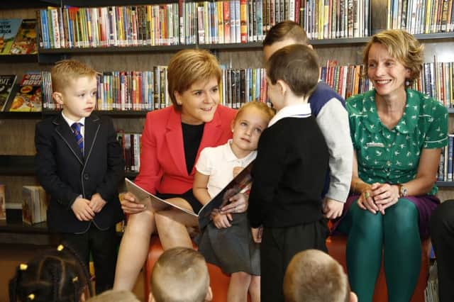 First Minister Nicola Sturgeon has praised the role of libraries in helping to empower people in deprived communities. Picture: PA
