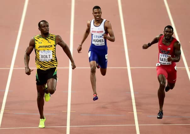 Jamaicas Usain Bolt wins the gold medal ahead of USAs Justin Gatlin in the 200 metres final. Picture: PA