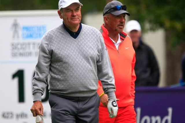 David J Russell and Sir Ian Botham walk off Archerfields 10th tee. Picture: Getty