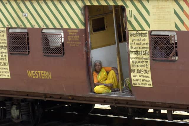 An elderly Indian woman takes advantage of women-only carriages in Mumbai. Picture: PA