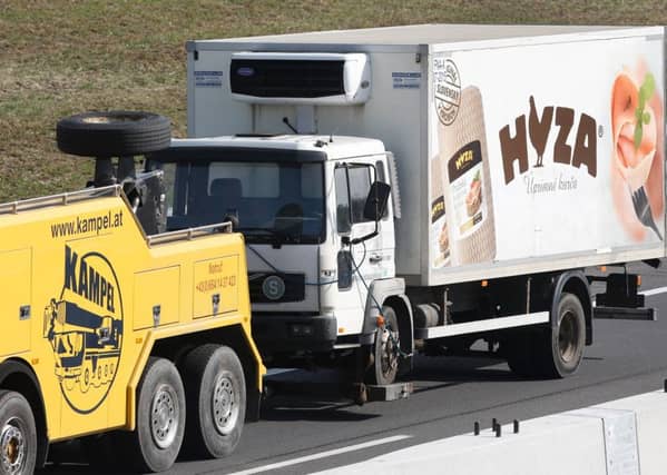 A refrigerated truck is towed along a highway near Neusiedl am See, Austria. Picture: Getty Images