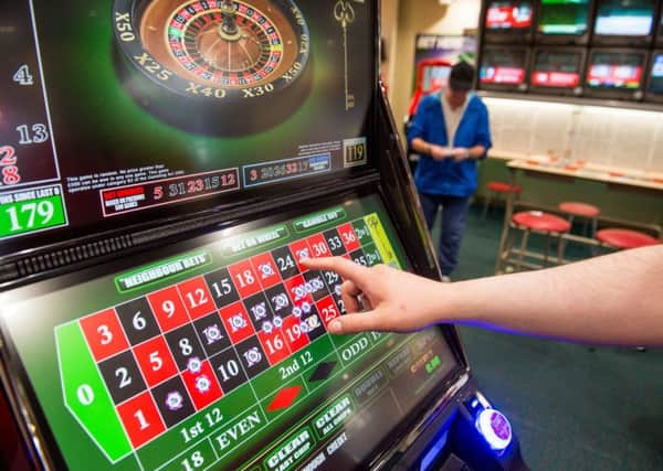 In the Glasgow area alone, more than £500,000 a day is ploughed into around 800 fixed odds betting terminals. Picture: Ian Georgeson