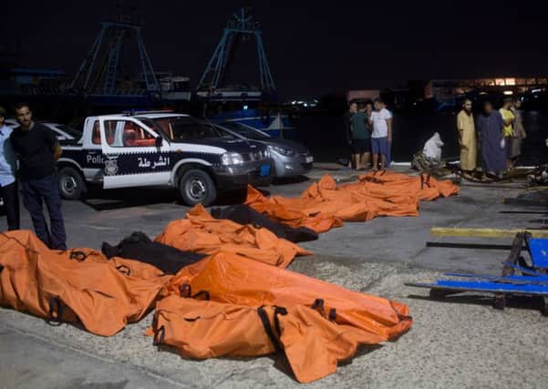 Bbodies of migrants who drowned off the coast when their boat sank are collected in Zuwara, Libya. Picture: AP