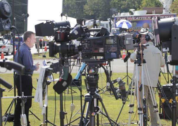 CNN reporter, Brian Todd, and his cameraman, Ray Britch, at the scene where two journalists were killed this morning during a live broadcast on August 26, 2015 in Moneta, Virginia. Picture: Getty Images