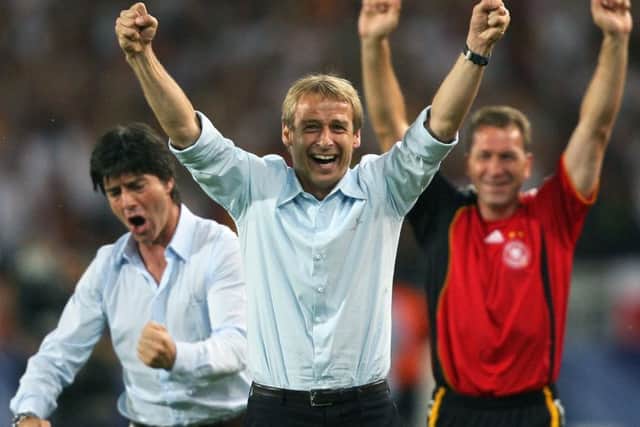 Head coach Jurgen Klinsmann, centre, celebrates a Germany goal with his then assistant, Joachim Low, left, who is now in charge of the national team. Picture: AFP/Getty
