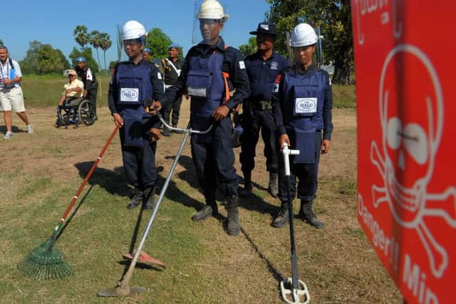 Cambodian deminers from the Halo Trust demonstrate mine detection techniques. Picture: AFP/Getty Images