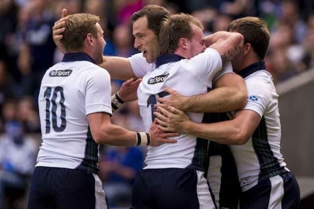 Finn Russell and Tim Visser celebrate as Scotland romp to victory. Picture: PA