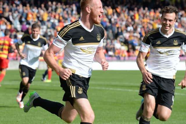 Adam Rooney celebrates nabbing the opener. Picture: SNS